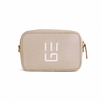 A beige textured leather camera bag with a white stylized 'G' logo on the front, gold-tone hardware, and a brown leather zipper pull, shown against a plain white background.